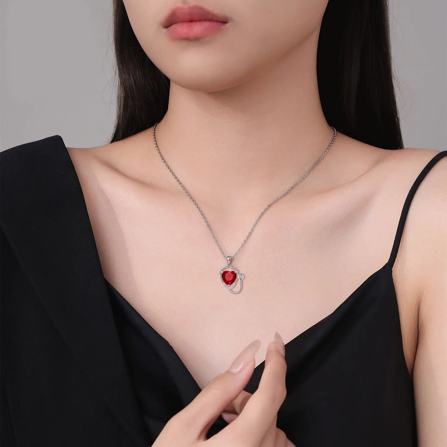 Women's copper electroplated stethoscope wings cross necklace in red diamond colour