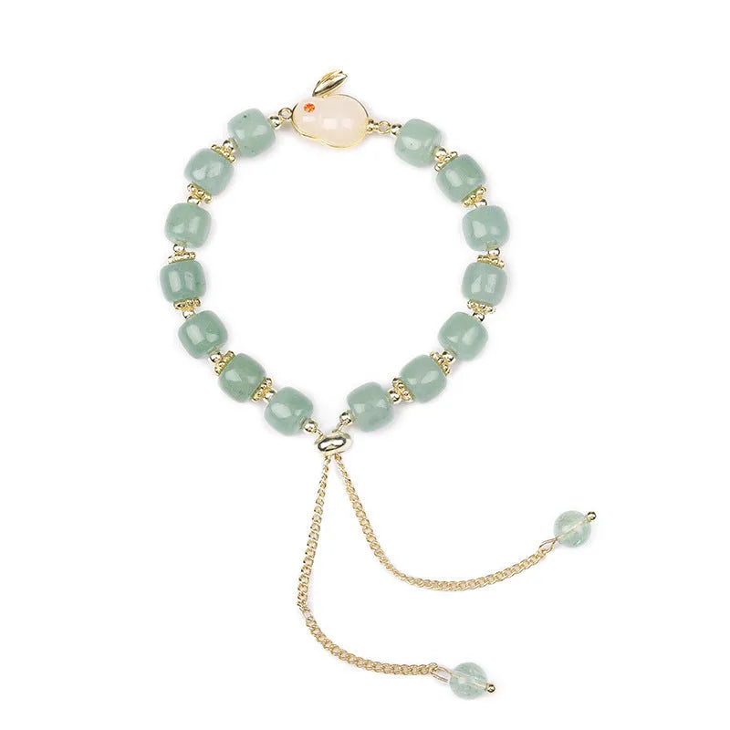 Rabbit charm bracelet with natural stone beads on copper-plated chain with gold accents