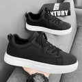 Men's low-top Korean-style sneakers in all black, all white, and black with white bottom colours on a rubber sole