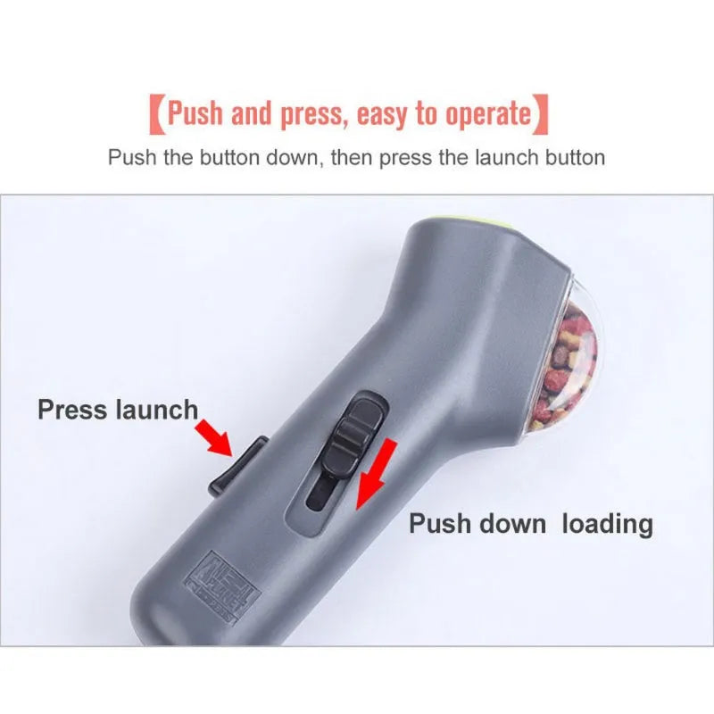 Grey plastic pet treat catapult launcher for dogs and cats on a neutral background