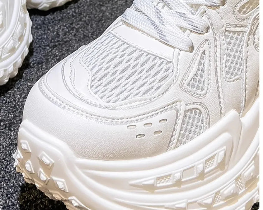 White women's height increasing dad shoes with lace-up front and round toe.