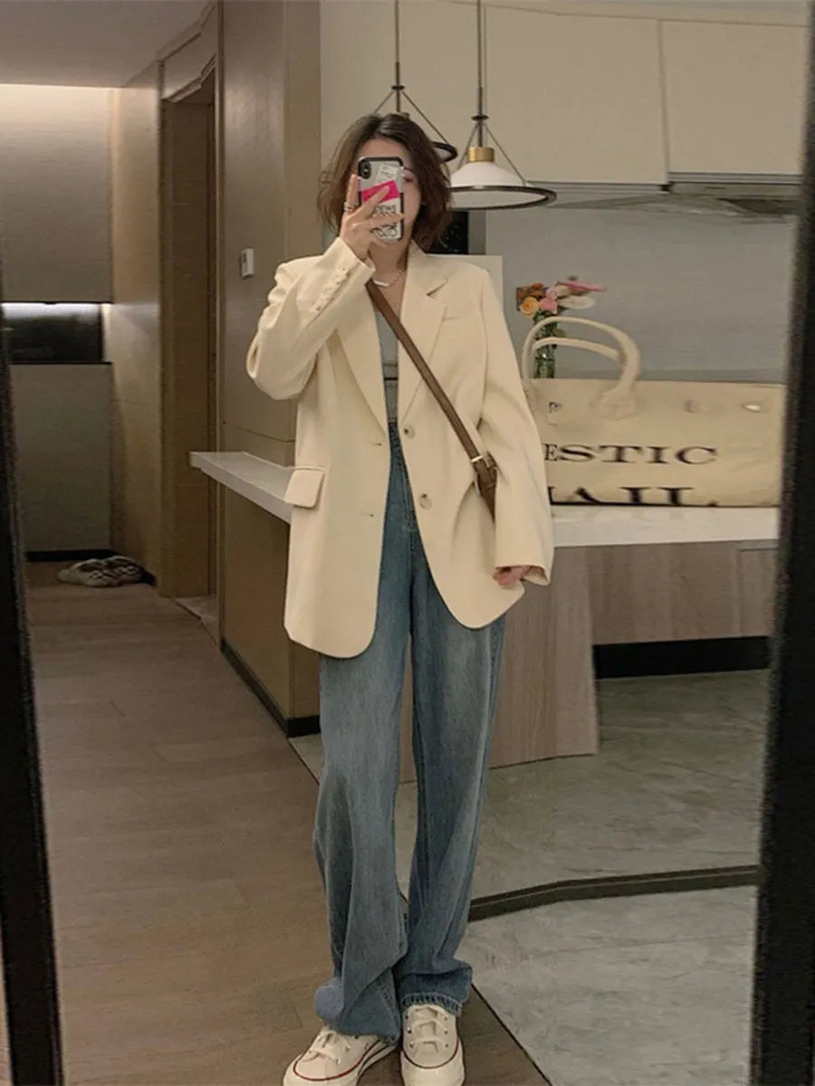 Women's Korean style solid color polyester suit jacket with regular long sleeves and pockets in black, beige, or coffee.