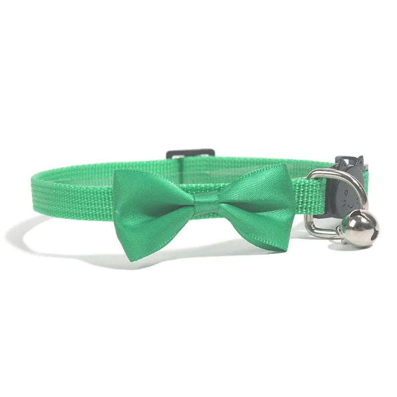 Adjustable striped nylon cat collar with bell in various colors including red, green, and blue