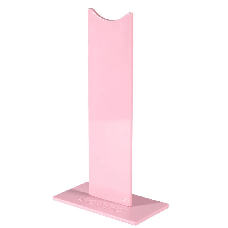 Black detachable head-mounted gaming headset bracket stand on a desk