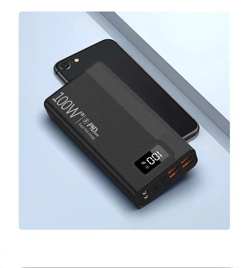 Large capacity power bank in black or white plastic casing with compact dimensions