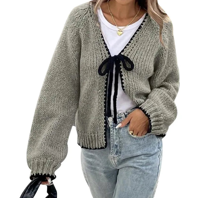Grey loose-fit lace-up cardigan with long sleeves and a crochet flower detail on the front.