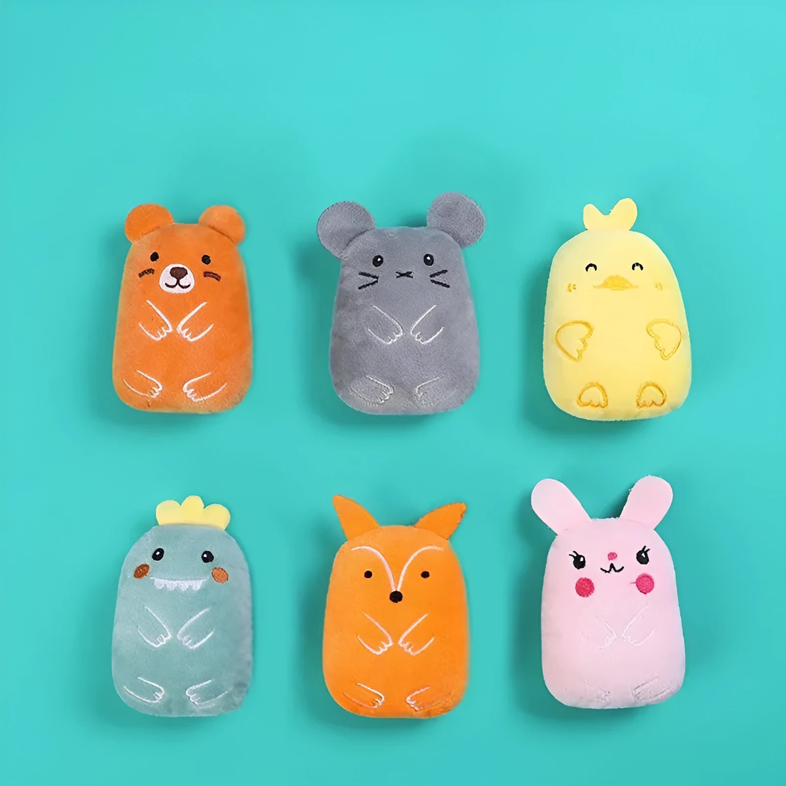 Small plush cat toy with catnip for teeth grinding and chewing play, measuring 11cm long in various animal designs and colours