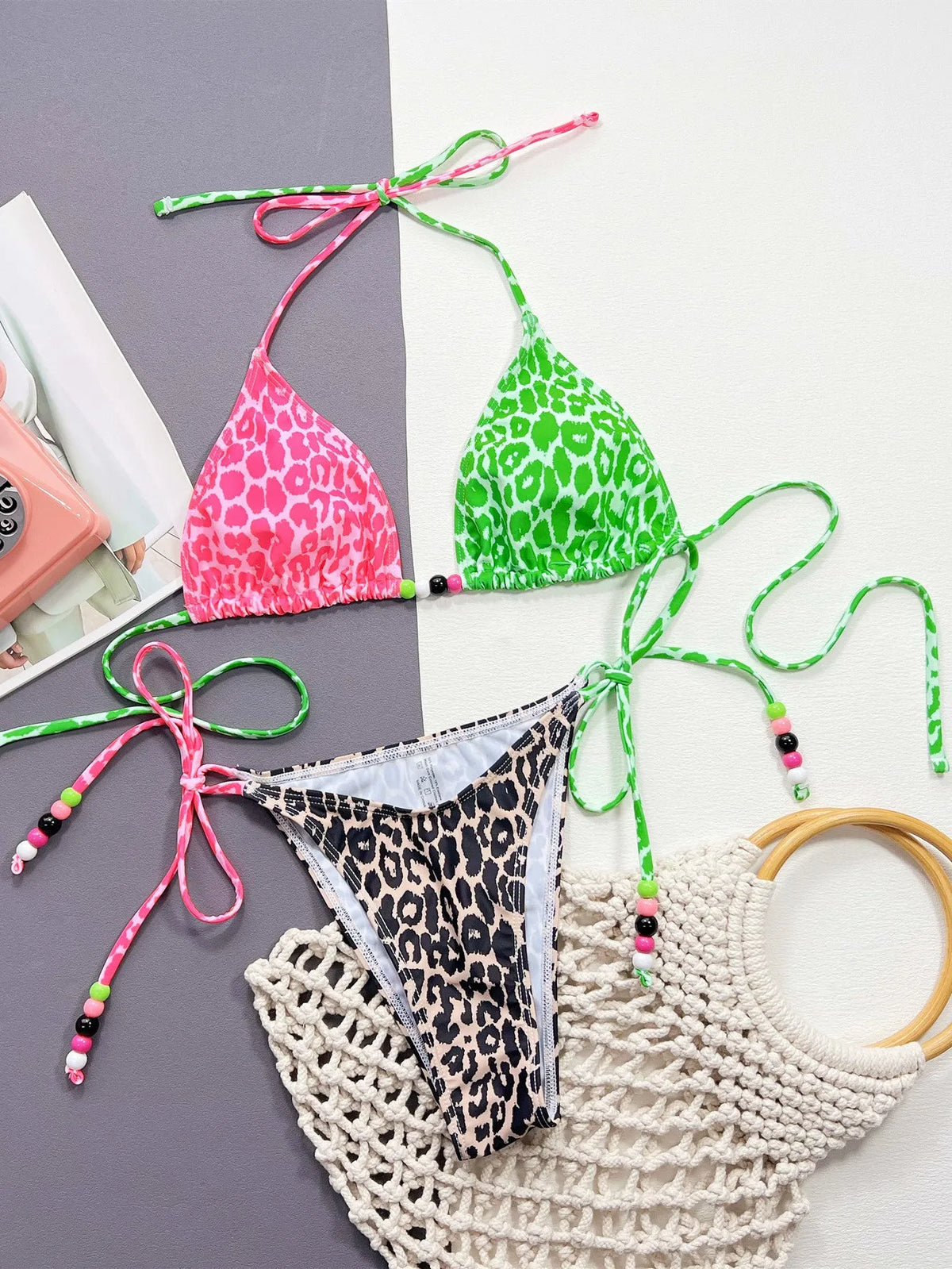 Women's leopard print bikini swimsuit with matching bra and briefs on size chart background