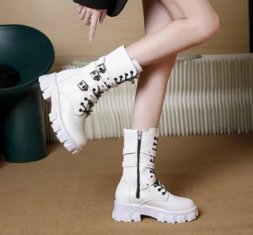 Women's black mid-calf knight boots with a metal buckle strap and side zipper on a round toe.