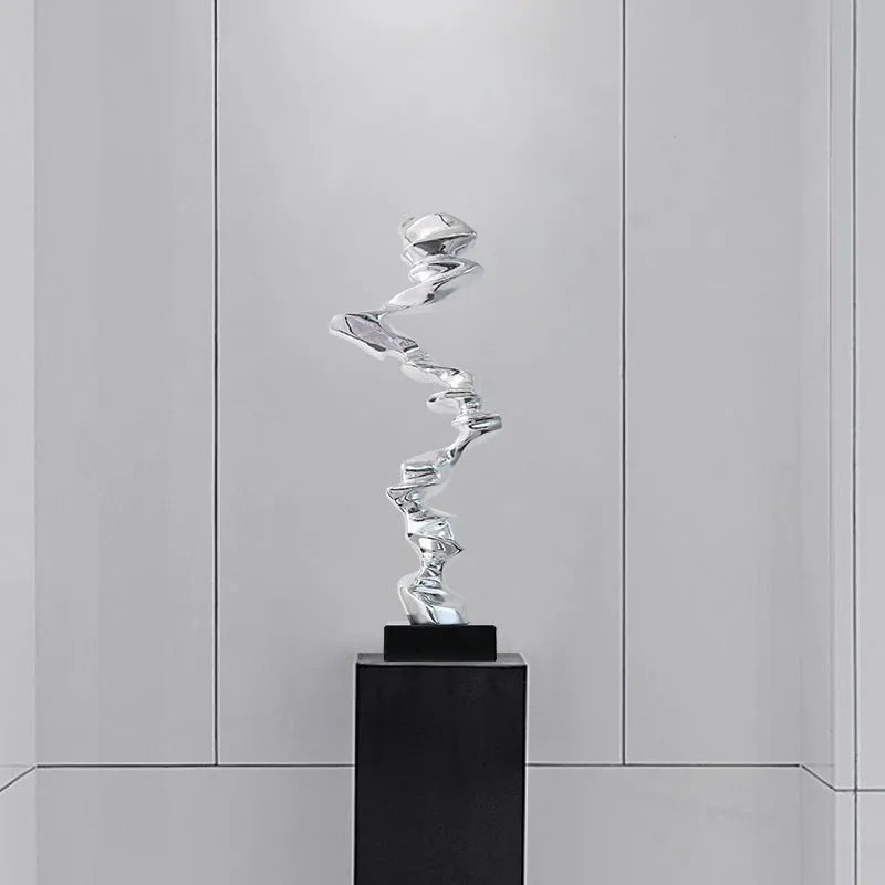 Abstract still life decorative sculpture in natural resin with metallic finish