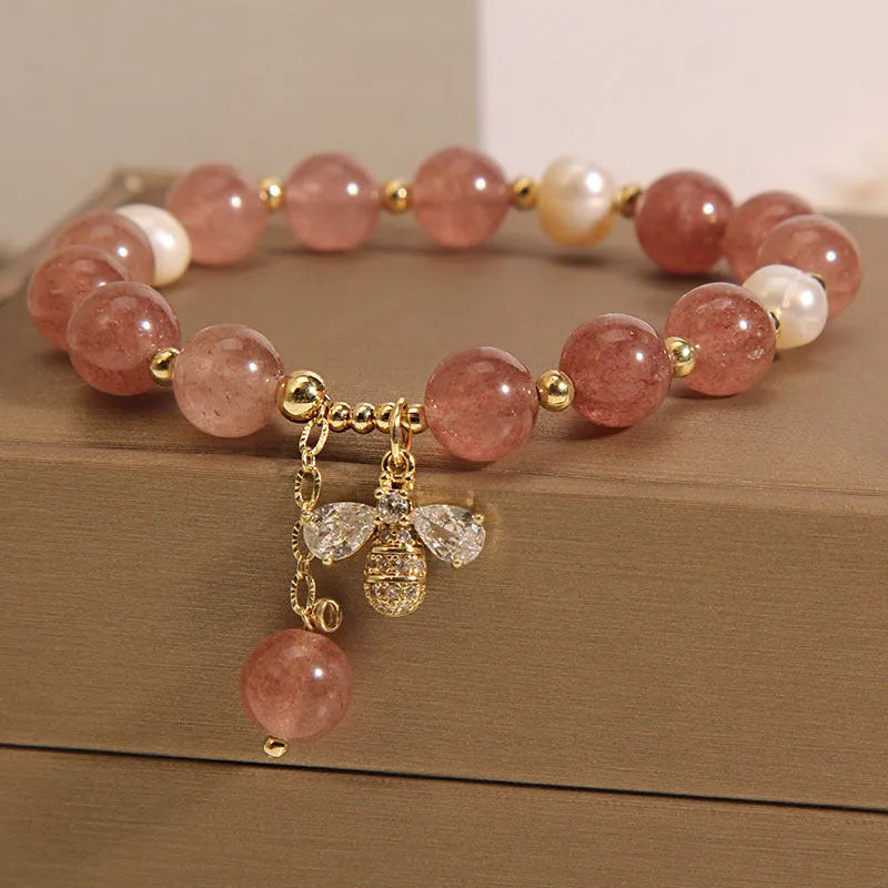 Women's bracelet with freshwater pearls and strawberry quartz stones with zircon accents on alloy hardware