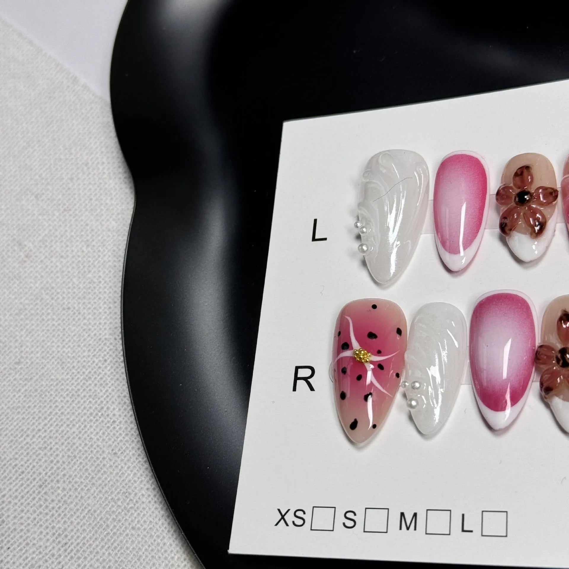 Hand-painted three-dimensional nail art patches with embossed candy patterns in almond shapes