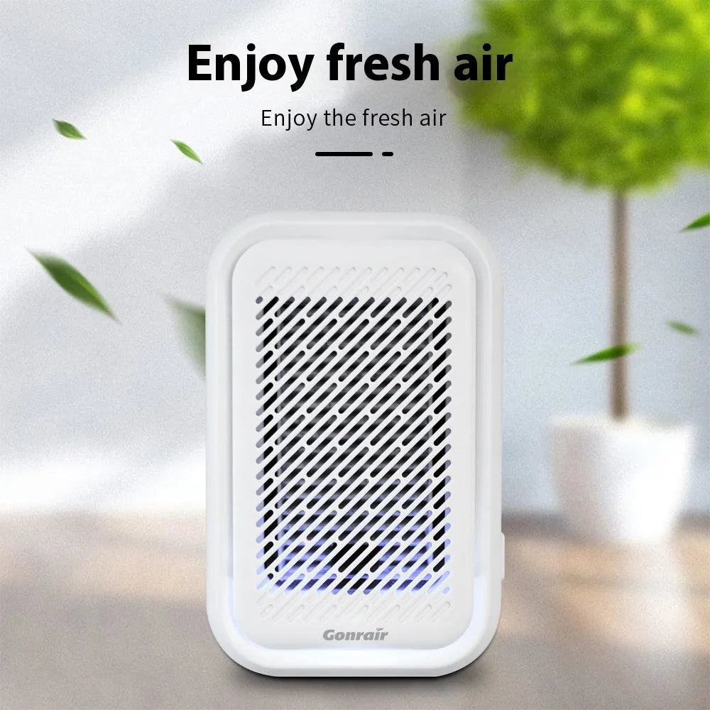 White wall-mounted air purifier with plug-in cord and filter screen