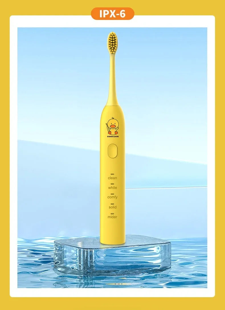 Small yellow duck design USB rechargeable electric toothbrush with soft bristles.