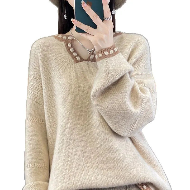 Women's camel coloured V-neck pullover sweater with long sleeves on a hanger.