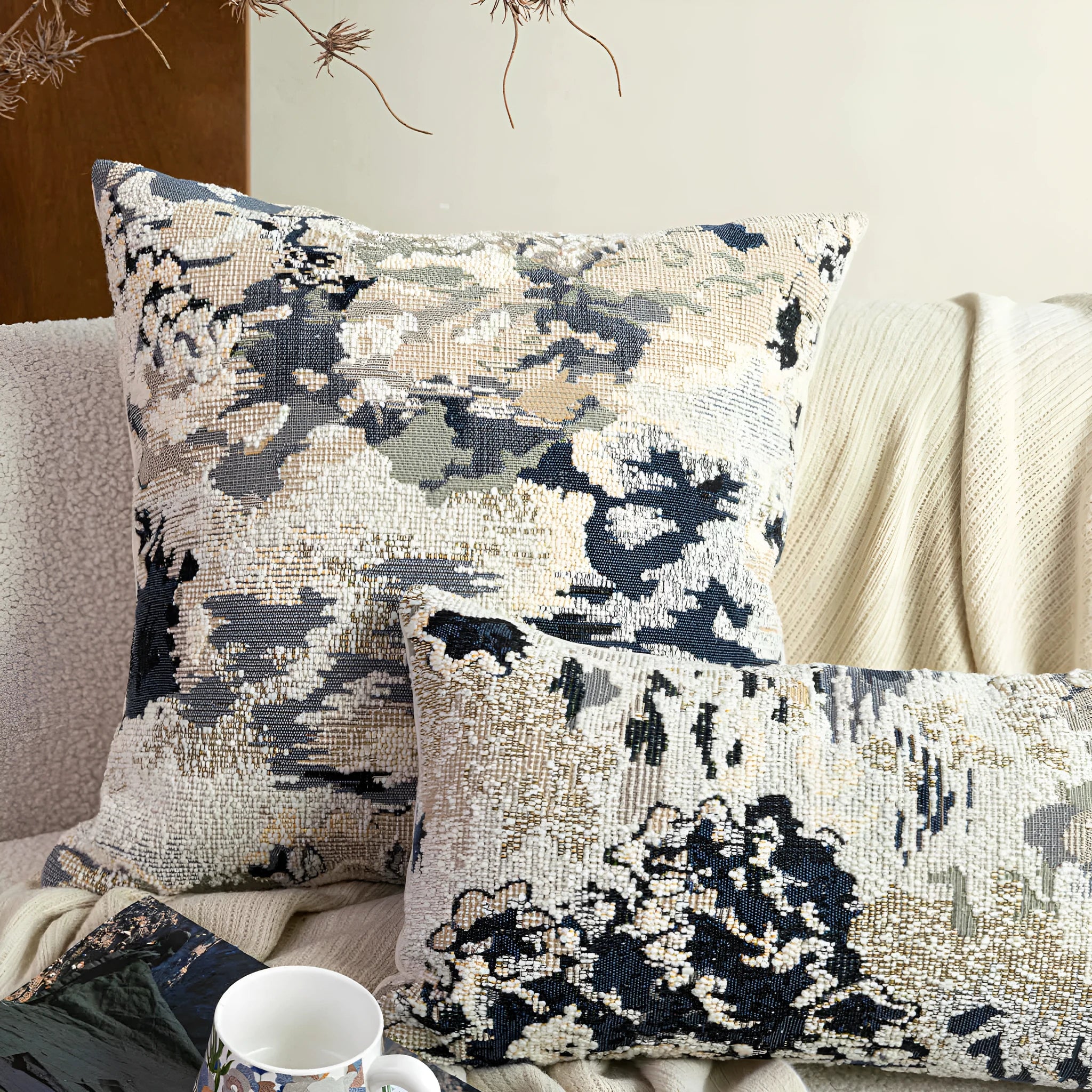 Antique blue decorative cushion with abstract floral pattern, shown in square and waist pillow sizes.