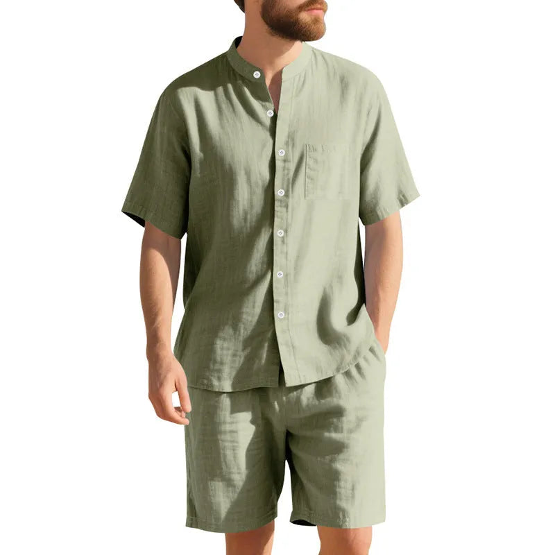 Men's light blue linen two-piece suit with short sleeve jacket and shorts on a hanger.