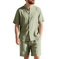 Men's light blue linen two-piece suit with short sleeve jacket and shorts on a hanger.