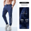 Men's black ankle-tied sweatpants with mid-waist, shown in a casual pose.