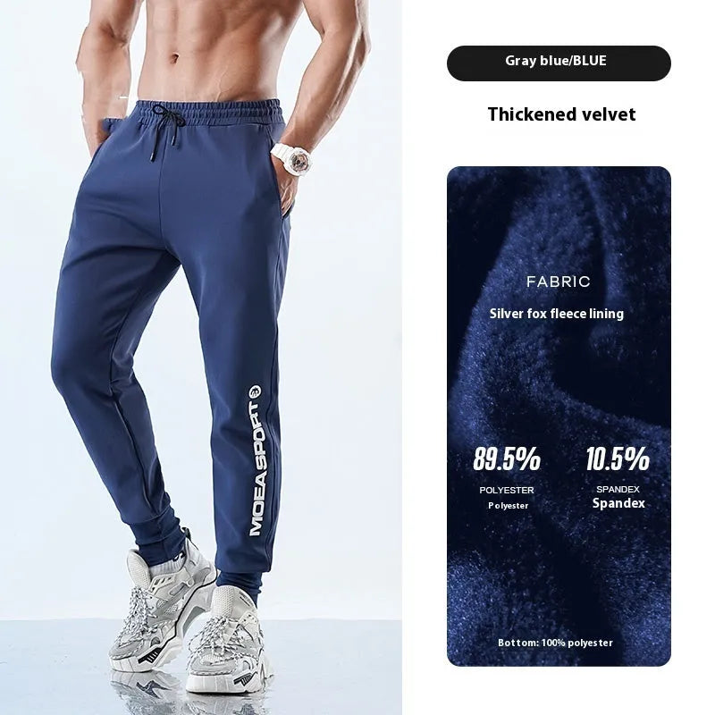 Men's black ankle-tied sweatpants with mid-waist, shown in a casual pose.