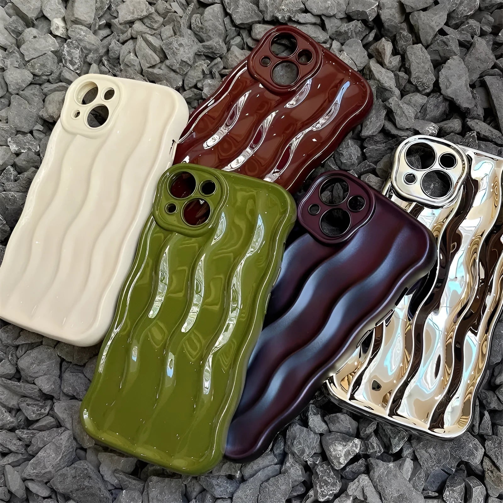 Silicone iPhone case with water ripple texture in burgundy colour on a table.