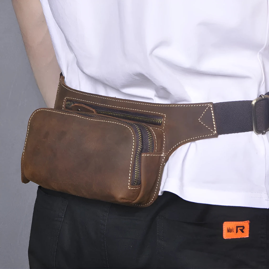 Brown cowhide leather men's sports waist bag showing pull closure and dimensions