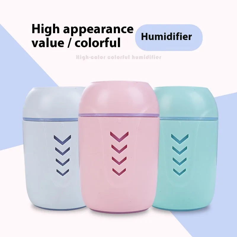Compact round portable air purifier in blue colour with USB cable for car or desk use.
