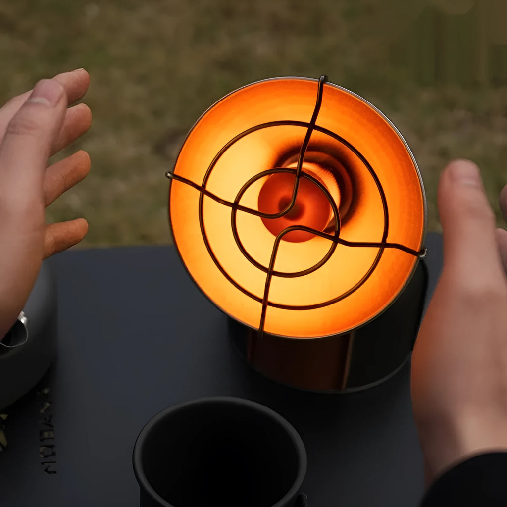Black and orange mini portable heating stove with stainless steel body and automatic press ignition for camping