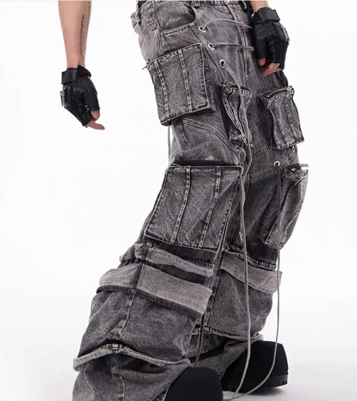 Grey distressed cotton denim men's overalls with rope stitching on the legs.