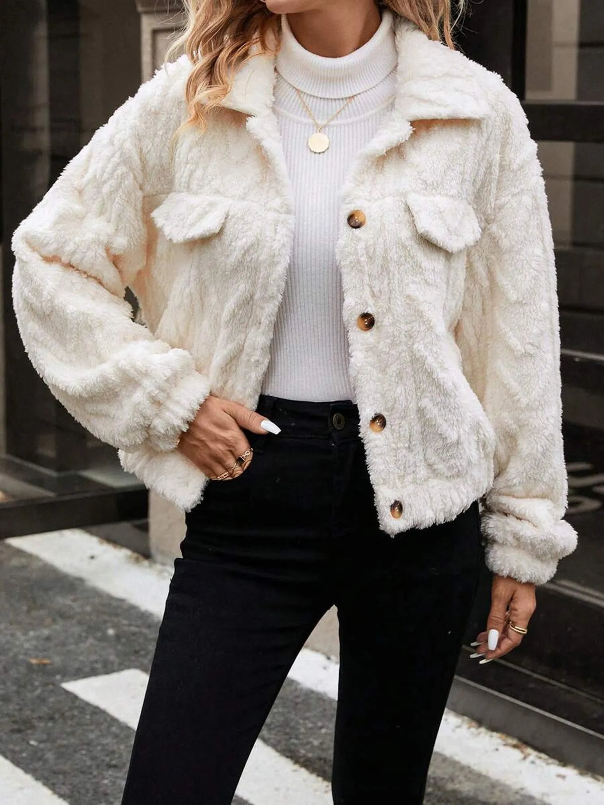 Women's ivory white double-sided plush button cardigan on a hanger