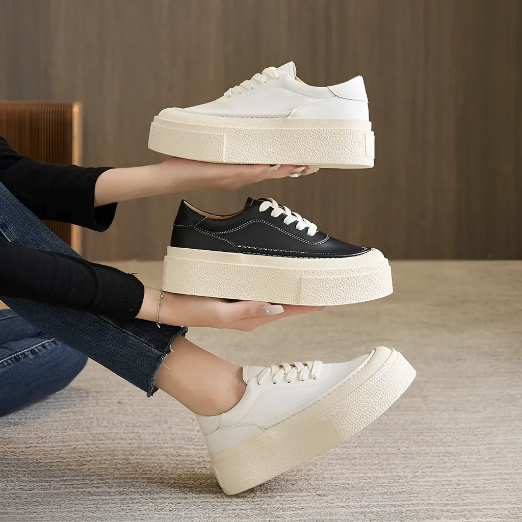 Women's black platform casual sports shoes with embossed cowhide upper and tied lace design