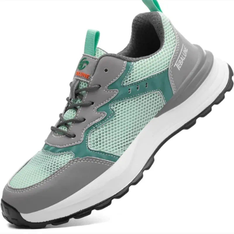 Green low-top work shoes with mesh panels, plastic steel toe cap, and slip-on design.