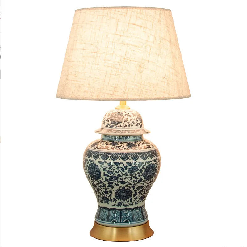 Chinese blue and white porcelain table lamp with ceramic base on bedside table