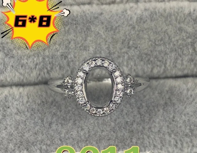 Oval denier ring ornament with open mouth design, 6x8mm stone and five-pointed star detail
