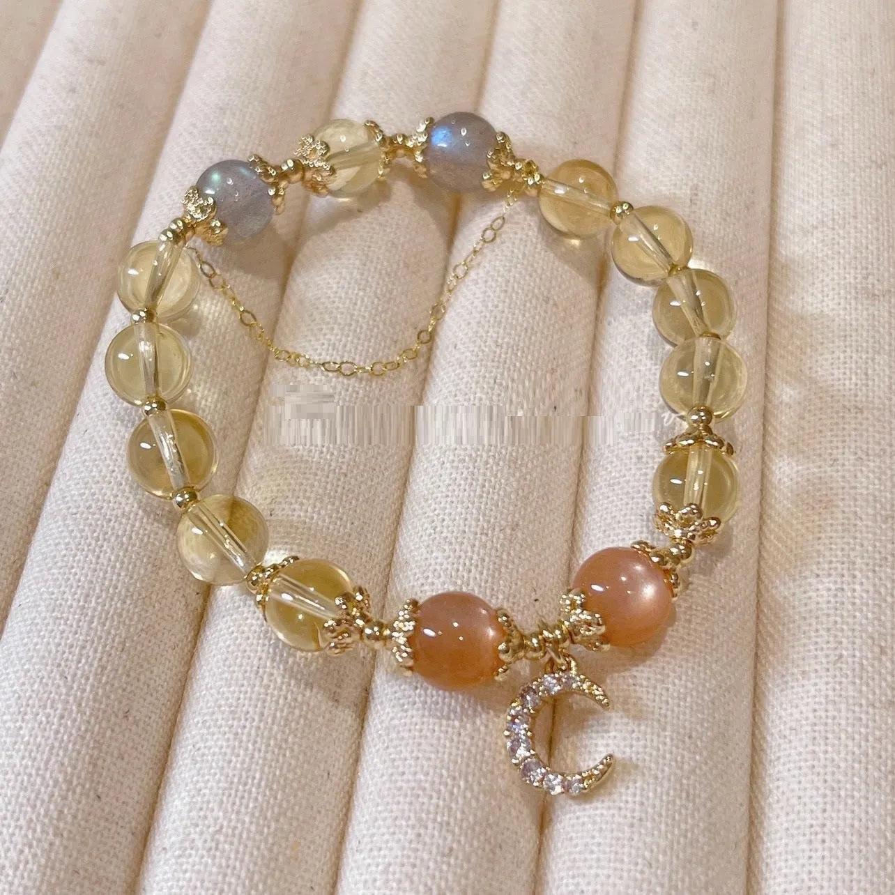 Chinese style women's crystal bracelet with electroplated 14K gilded finish and diamond-shaped moonstone golden sun stone elements