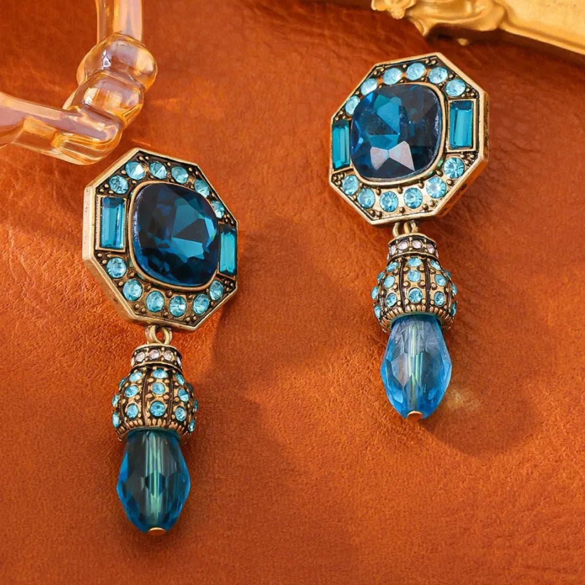 Full-jeweled geometric octagonal stud earrings in blue or green copper alloy for female wearers