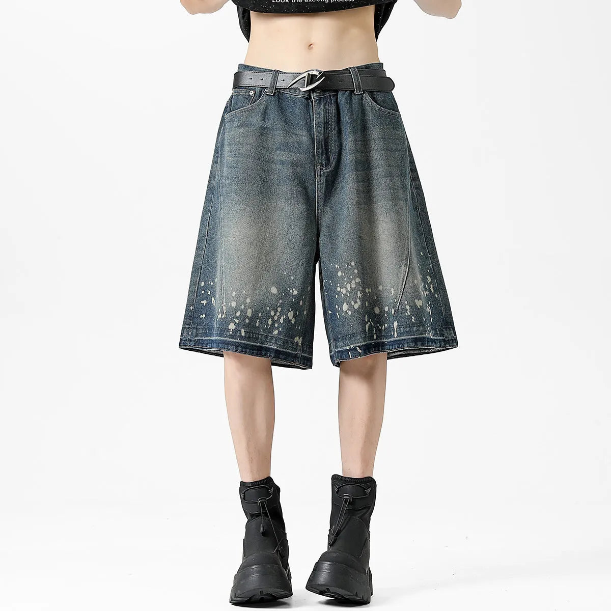 Retro blue washed denim shorts for men with ripped splash ink details and a straight leg cut.