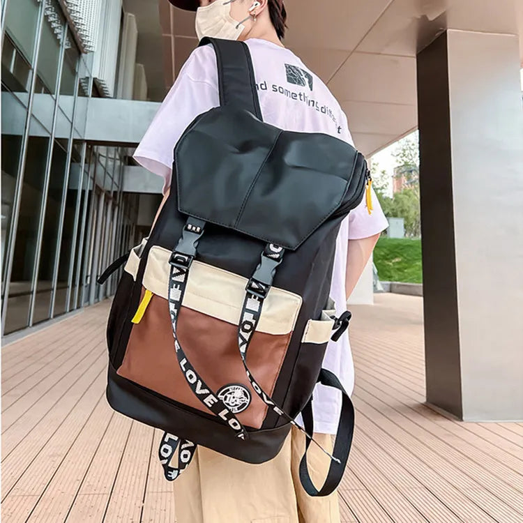 Oxford cloth school backpack in black, green, or red with handheld, shoulder and backpack carrying options