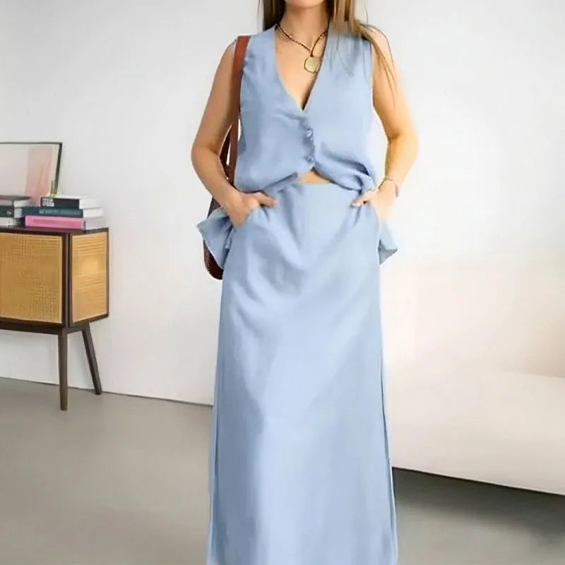 A woman's casual two-piece suit with a sleeveless loose vest and a long matching skirt.