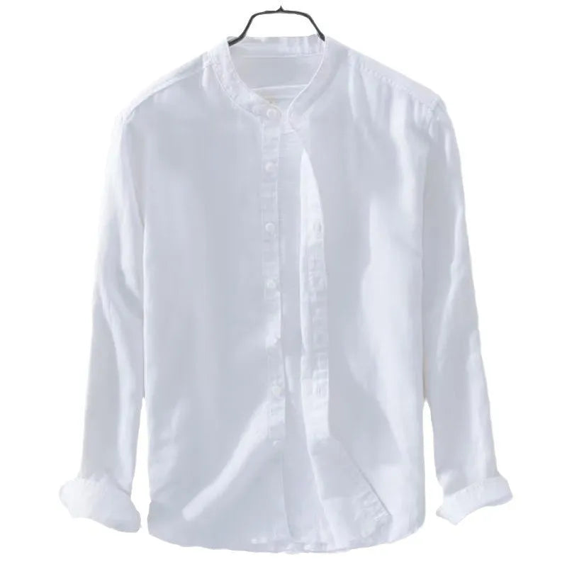 Man wearing a loose-fitting light blue long sleeve casual shirt made from cotton linen blend.