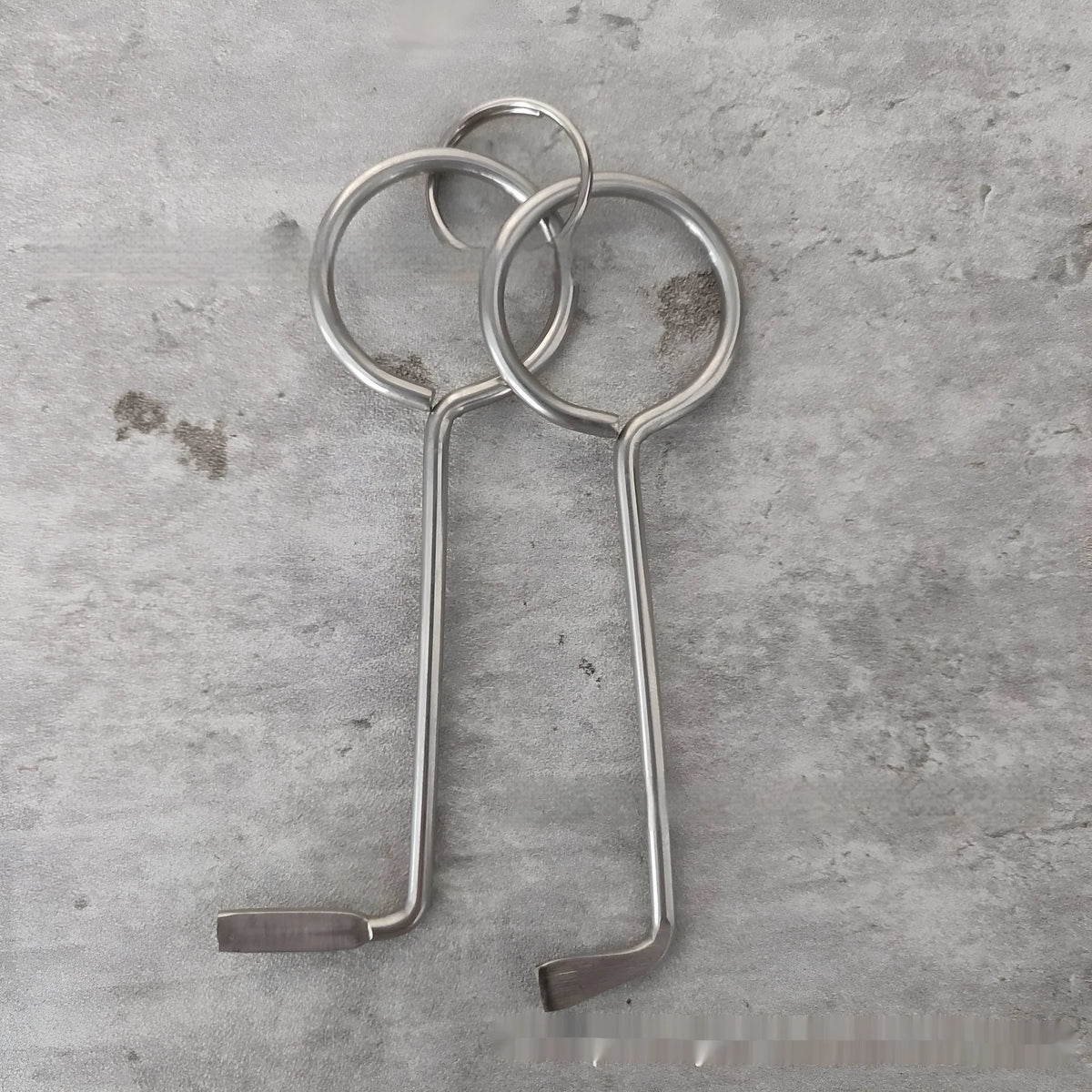 Two alloy wrench tools from a portable universal maintenance set.