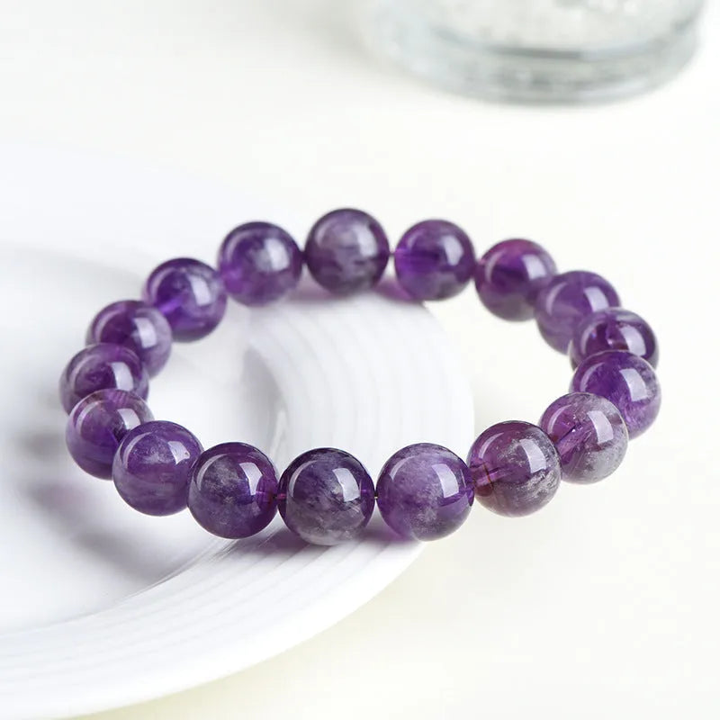 Natural feather amethyst crystal bracelet with Snow Mountain purple scattered beads and a Ruyi geometry design.