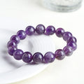 Natural feather amethyst crystal bracelet with Snow Mountain purple scattered beads and a Ruyi geometry design.