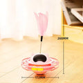 Pink cat tumble spinner toy with feather attachment measuring 17x10cm for independent feline play