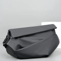 Men's black PU leather crossbody sling backpack with shoulder strap and zipper opening