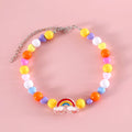 Colourful plastic pearl pet necklace for cats with adjustable sizing in rainbow, peach, and small flower patterns