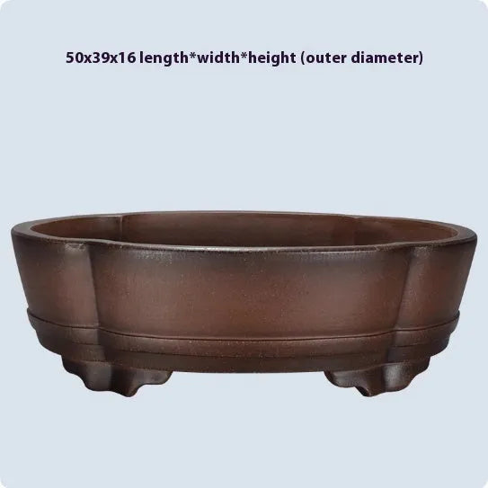 Classical style purple clay bonsai flower pot for indoor plants on a tabletop.