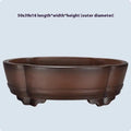 Classical style purple clay bonsai flower pot for indoor plants on a tabletop.