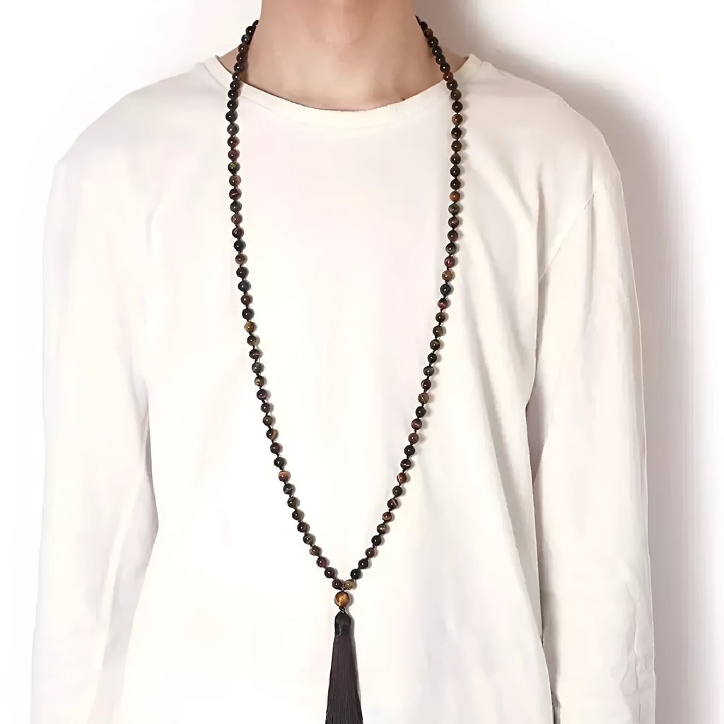 Long beaded agate necklace with geometric stones and a tassel, showing colourful variations.