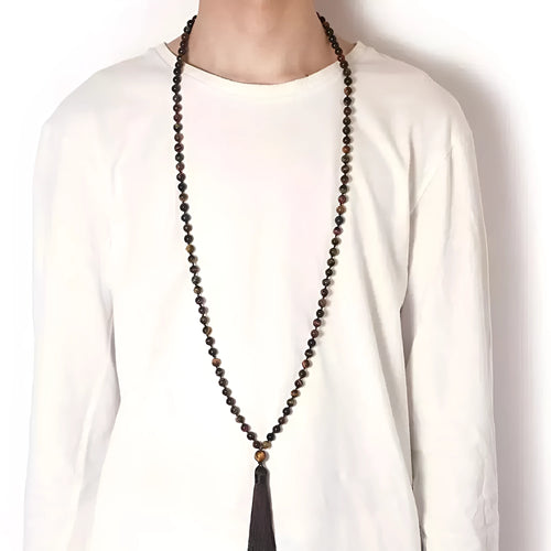 Long beaded agate necklace with geometric stones and a tassel, showing colourful variations.